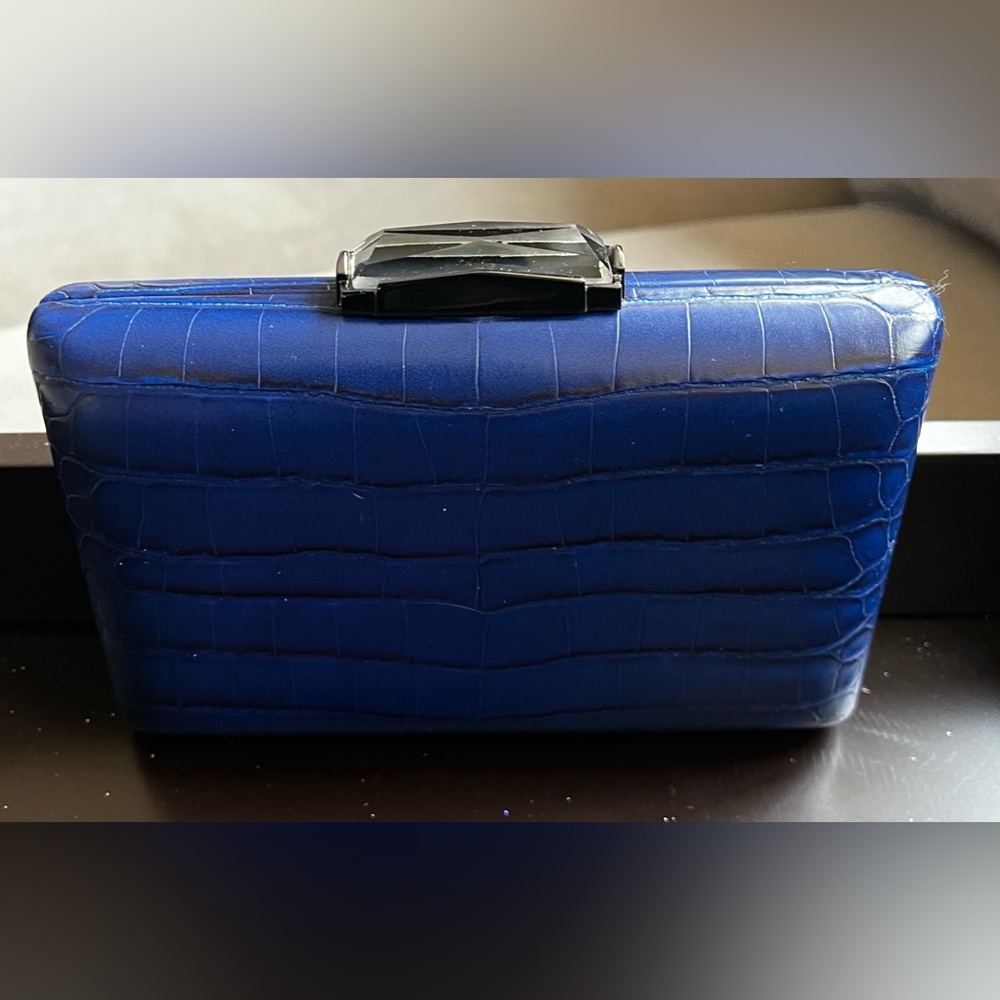Orly Dinner/party clutch in blue with gemstone closure.